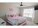 Charming bedroom featuring neutral walls, bright white trim, and a ceiling fan at 217 Hydrangea Dr, Clover, SC 29710