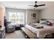 This bedroom has a fan and large window to let in plenty of natural light at 217 Hydrangea Dr, Clover, SC 29710