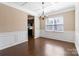Open dining room with hardwood floors, coffered ceiling, and natural light from a large window at 217 Hydrangea Dr, Clover, SC 29710
