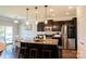 Spacious kitchen featuring a center island, granite countertops, stainless steel appliances, and a breakfast nook at 217 Hydrangea Dr, Clover, SC 29710