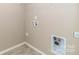 Practical laundry room space with tile flooring and connections for laundry appliances at 217 Hydrangea Dr, Clover, SC 29710