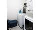 Functional laundry room with white washer and dryer, storage baskets, and ample space at 217 Hydrangea Dr, Clover, SC 29710