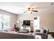 Inviting living room featuring a ceiling fan, comfortable seating, and a television at 217 Hydrangea Dr, Clover, SC 29710