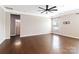 Spacious main bedroom with hardwood floors, large window, and ensuite bathroom entrance at 217 Hydrangea Dr, Clover, SC 29710