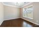 Bright study with hardwood floors, large window, and modern ceiling light fixture at 217 Hydrangea Dr, Clover, SC 29710
