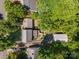An aerial view of a residential neighborhood, showing a home and surrounding tree coverage and neighboring houses at 2342 Castlecomer Dr, Charlotte, NC 28262