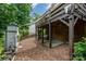 Inviting backyard featuring a wooden deck with a swing and a stone fireplace at 2342 Castlecomer Dr, Charlotte, NC 28262