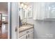 Compact bathroom features granite countertop vanity and decorative mirrors; a practical and stylish space at 2342 Castlecomer Dr, Charlotte, NC 28262