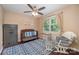 Cozy Bedroom with hardwood floors, a crib, rocking chair, and a decorative rug, creating a warm atmosphere at 2342 Castlecomer Dr, Charlotte, NC 28262