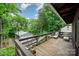 Relaxing deck overlooking a lush, green backyard and a large detached garage at 2342 Castlecomer Dr, Charlotte, NC 28262