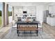 Bright open-plan dining area featuring stylish pendant lights and access to the kitchen at 2635 Tillman St, Monroe, NC 28112