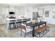 Well-lit kitchen with stainless appliances and an island open to the dining room at 2635 Tillman St, Monroe, NC 28112