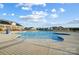 Resort-style pool area with ample seating, clubhouse, and neighborhood homes at 2635 Tillman St, Monroe, NC 28112