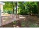 Backyard with spacious deck, mature trees and plenty of shaded area at 2729 S Ridge Ave, Concord, NC 28025