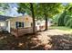 Quaint home with back deck and large trees shading the yard at 2729 S Ridge Ave, Concord, NC 28025