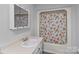 Bathroom featuring vanity sink and bathtub with leafy-patterned shower curtain at 2729 S Ridge Ave, Concord, NC 28025