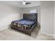 Bedroom boasts stylish wood-finished bed frame with mounted bedside lamps and ceiling fan at 2729 S Ridge Ave, Concord, NC 28025