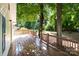 View of the deck with brown railing overlooking backyard surrounded by mature trees at 2729 S Ridge Ave, Concord, NC 28025