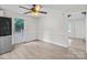 Inviting dining area with wood-look floors, natural light, and easy access to both kitchen and backyard at 2729 S Ridge Ave, Concord, NC 28025