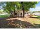Charming home featuring a covered front porch, brick path, and mature trees at 2729 S Ridge Ave, Concord, NC 28025