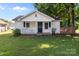 Charming house exterior featuring a covered porch, mature trees, and a well-maintained lawn at 2729 S Ridge Ave, Concord, NC 28025
