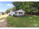 Charming house exterior with a covered porch and mature trees in the background at 2729 S Ridge Ave, Concord, NC 28025