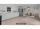 Open-concept kitchen and dining area featuring white cabinets, stainless steel appliances, and a bright atmosphere at 2729 S Ridge Ave, Concord, NC 28025