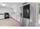 Bright kitchen features white cabinets, black appliances, and an LG refrigerator at 2729 S Ridge Ave, Concord, NC 28025