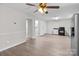 Open-concept living space with a kitchen and dining area, featuring bright lighting and modern appliances at 2729 S Ridge Ave, Concord, NC 28025