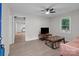 Cozy living room featuring wood-look floors, a modern ceiling fan, and a comfortable sitting area at 2729 S Ridge Ave, Concord, NC 28025