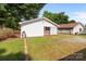 View of the detached outbuilding with white siding and mature trees at 2729 S Ridge Ave, Concord, NC 28025