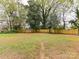 Large backyard with a shed and a wood privacy fence at 2816 Eastport Rd, Charlotte, NC 28205