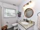 Bathroom with vanity, wood accents, a shower and updated fixtures at 2816 Eastport Rd, Charlotte, NC 28205
