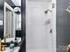Updated bathroom featuring a glass shower with subway tiles and matte black accents at 2816 Eastport Rd, Charlotte, NC 28205