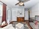 Bright Bedroom features a ceiling fan, an area rug, and an accent wall at 2816 Eastport Rd, Charlotte, NC 28205