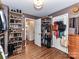 Organized walk-in closet with hardwood floors, custom shelving, and plenty of storage space at 2816 Eastport Rd, Charlotte, NC 28205