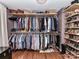 Spacious walk-in closet with hardwood floors and custom shelving for ample storage at 2816 Eastport Rd, Charlotte, NC 28205