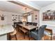 Traditional dining room with wood table, upholstered chairs, bench seating and modern light fixture at 2816 Eastport Rd, Charlotte, NC 28205