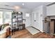 Bright foyer with hardwood floors, featuring a decorative shelf and ample natural light at 2816 Eastport Rd, Charlotte, NC 28205