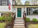 Welcoming entrance featuring a green door, brick steps, and classic address display at 2816 Eastport Rd, Charlotte, NC 28205