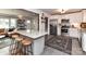 Open kitchen boasts an island with bar seating, stainless steel appliances and tile flooring at 2816 Eastport Rd, Charlotte, NC 28205