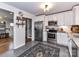 Bright kitchen features white cabinets, stainless steel appliances, granite countertops and an area rug at 2816 Eastport Rd, Charlotte, NC 28205