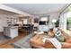 Open layout features a comfortable living room connected to a bright kitchen and dining area at 2816 Eastport Rd, Charlotte, NC 28205