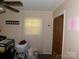 Cozy Bedroom features crib, bassinet, window, and closet with paneled doors at 2826 Drew Dr, Lancaster, SC 29720
