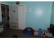 bedroom with play area, neutral walls, and adjacent bathroom access at 2826 Drew Dr, Lancaster, SC 29720