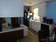 Efficient kitchen layout with black appliances, white cabinets, and blue accent walls at 2826 Drew Dr, Lancaster, SC 29720