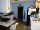 Cozy kitchen featuring tile flooring, white cabinets, and a black refrigerator at 2826 Drew Dr, Lancaster, SC 29720
