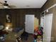 Features a wood-paneled room with a door leading outside, and a small chaise lounge at 2826 Drew Dr, Lancaster, SC 29720