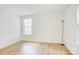 Bright bedroom with hardwood floors, a window, and ample natural light at 2916 Iron Gate Ln, Charlotte, NC 28212
