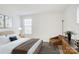 Bedroom featuring a comfortable bed, modern decor, and natural light from the window at 2916 Iron Gate Ln, Charlotte, NC 28212